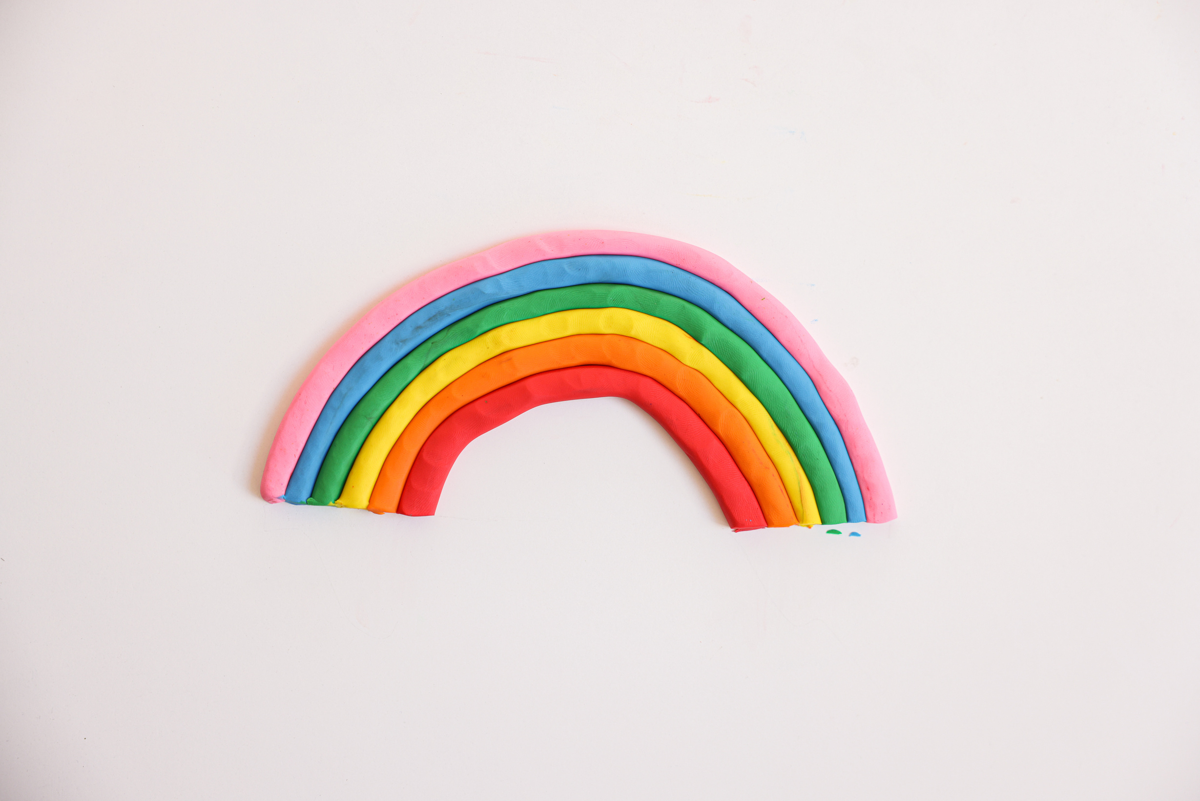 A Rainbow Art Made with Clay on a White Surface